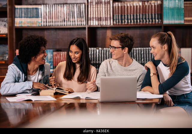 Students collaborating in library